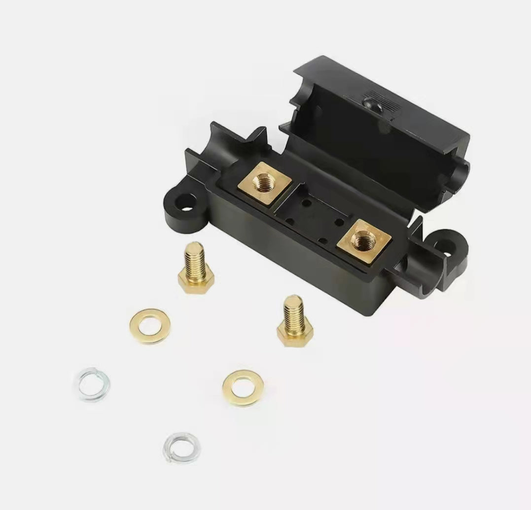 midi fuse kit Black metal bracket with gold screws and washers on a white background