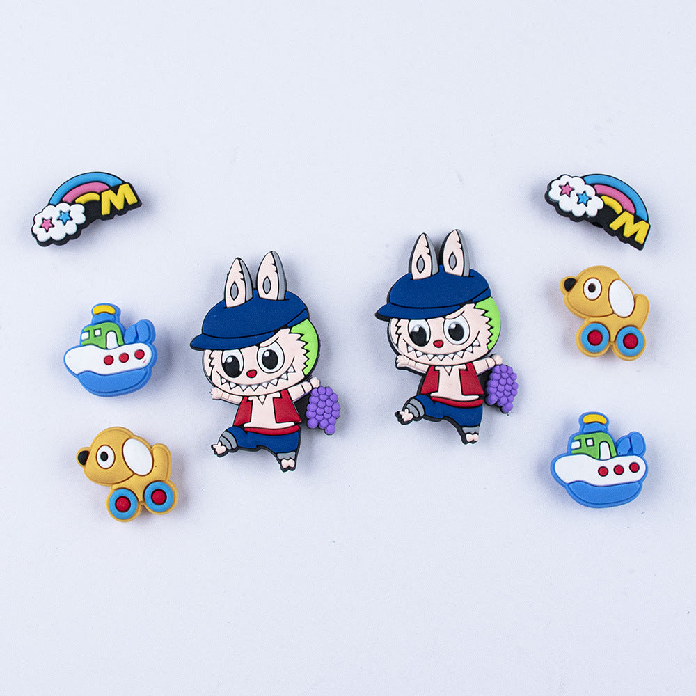Colorful labubu shoe charms cartoon character pins on a light blue background