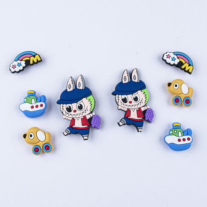 Colorful labubu shoe charms cartoon character pins on a light blue background