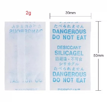 Desiccant silica gel packet with text and dimensions on a white background