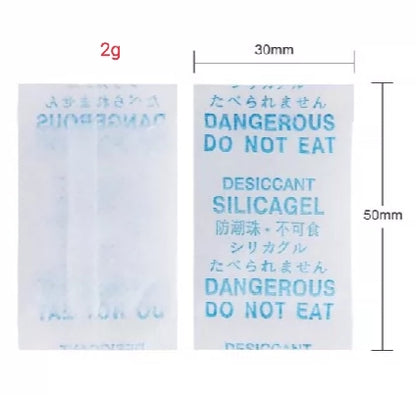 Desiccant silica gel packet with text and dimensions on a white background