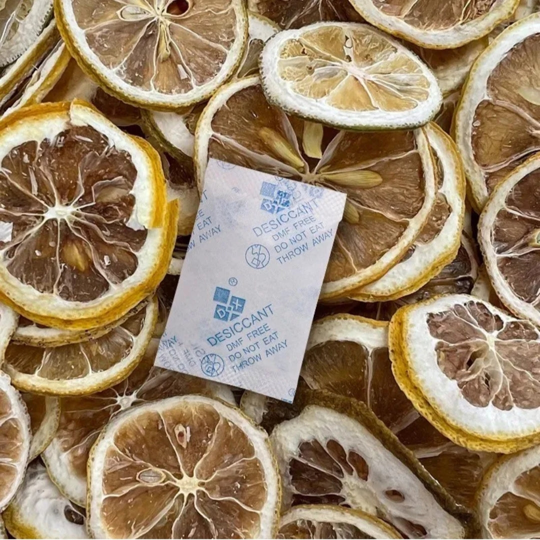 Desiccant packet among dried lemon slices