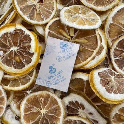 Desiccant packet among dried lemon slices