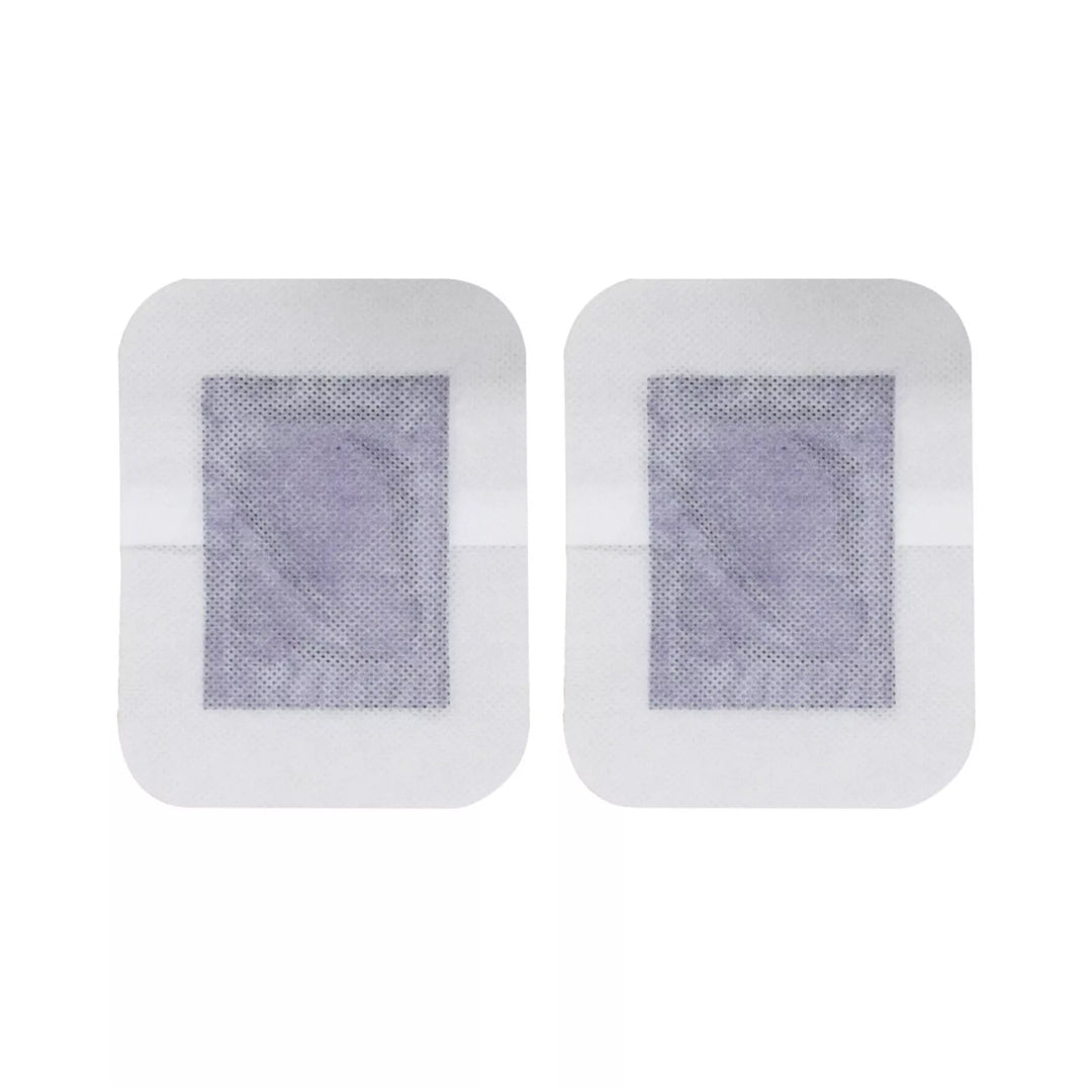 Two detox foot patches on a white background
