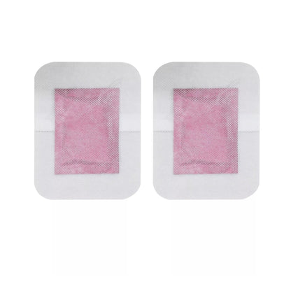 Two detox foot patches with pink centers on a white background