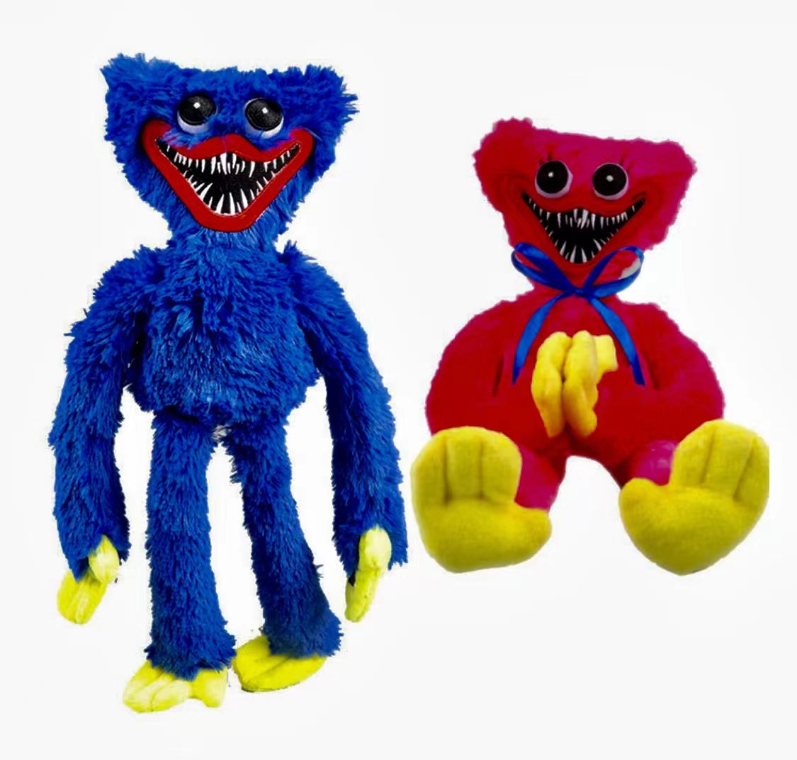 Two colorful huggie wuggie plush toys, one blue and one red with yellow feet, on a white background.