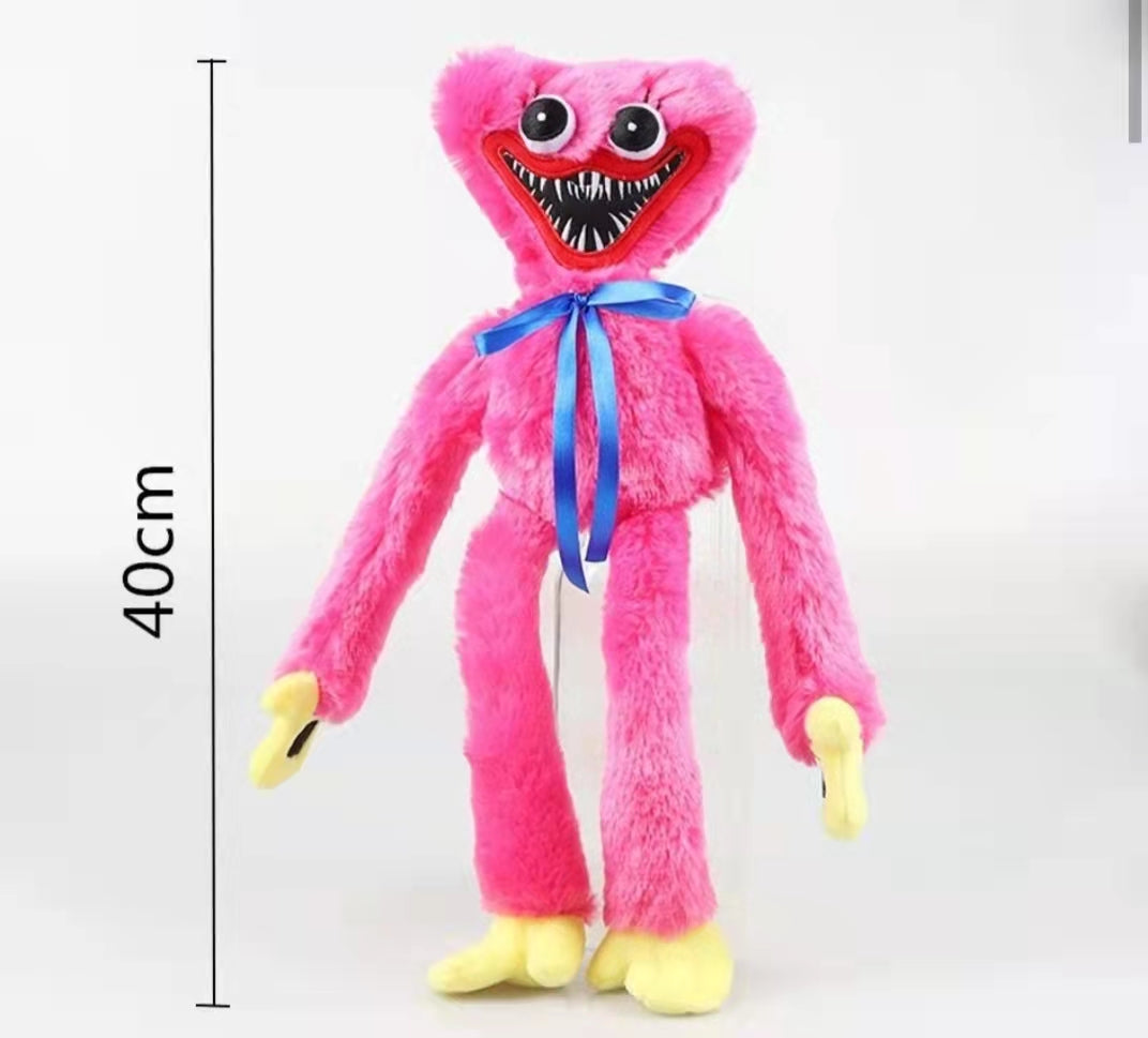 huggie wuggie Pink plush toy with a blue ribbon and measurements on a white background