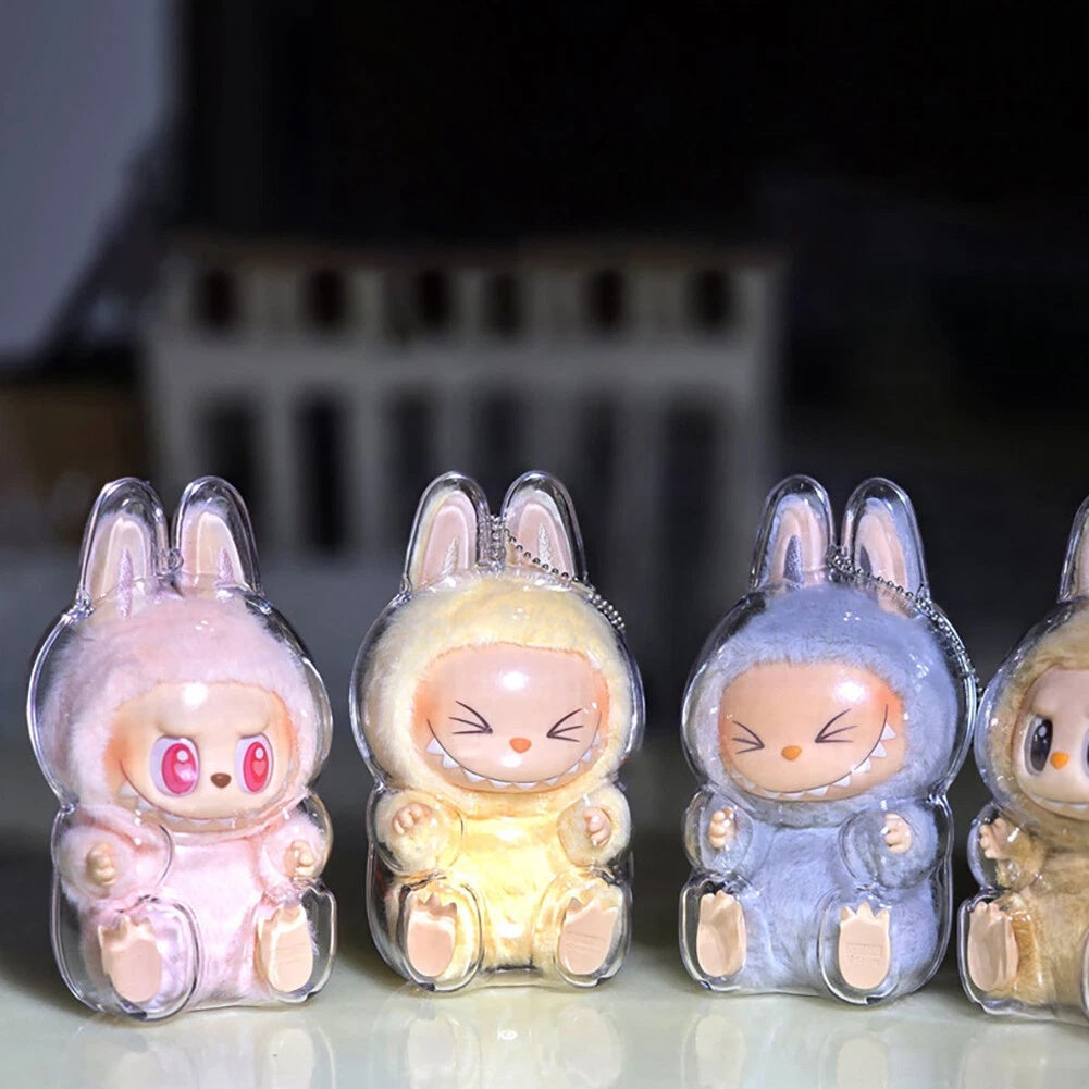 labubu Four cute rabbit-shaped night lights in clear packaging on a reflective surface.