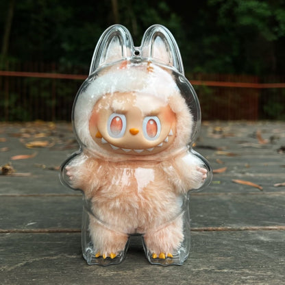 labubu Plush toy with rabbit ears in a clear plastic case on a wooden surface