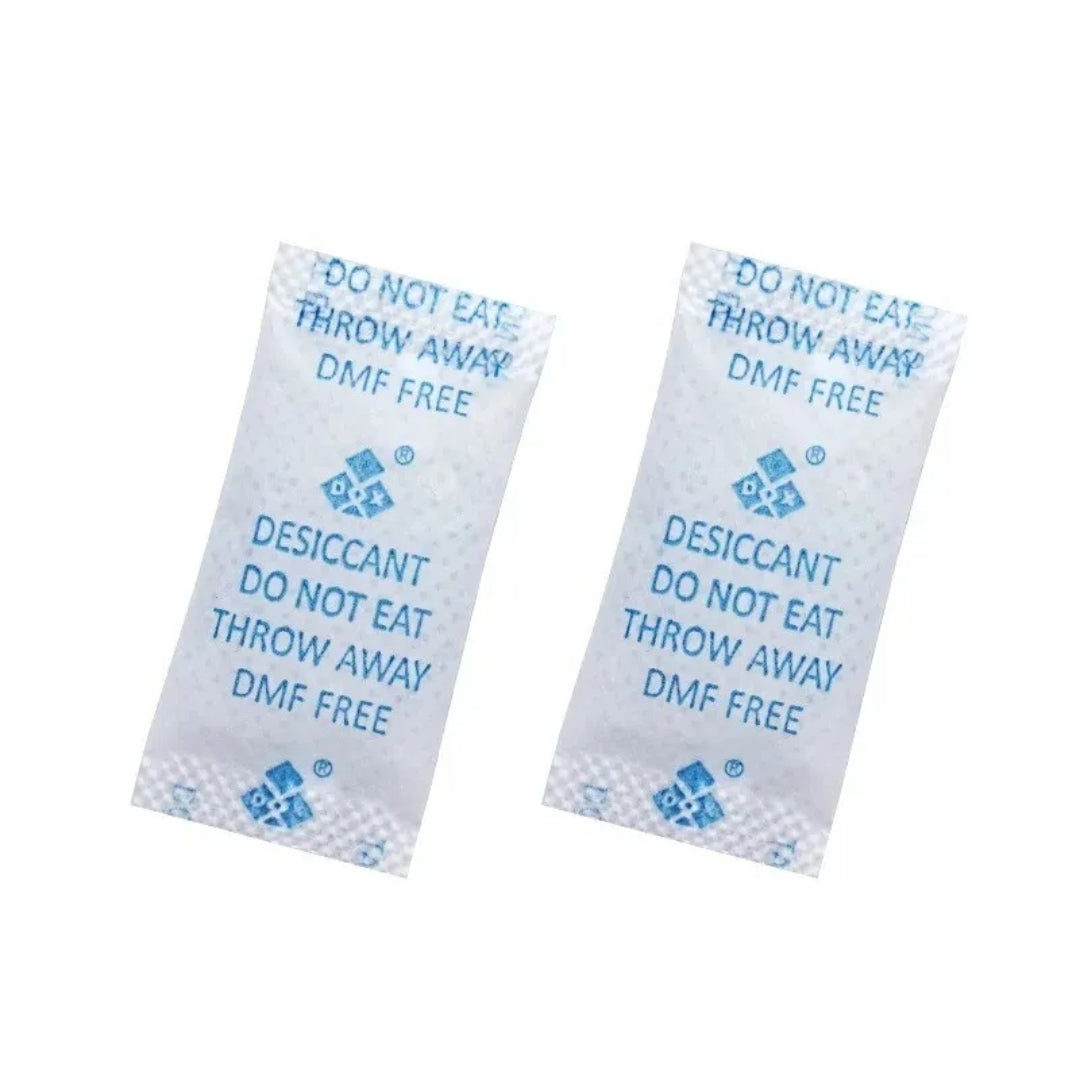 Two desiccant packets with text on a white background