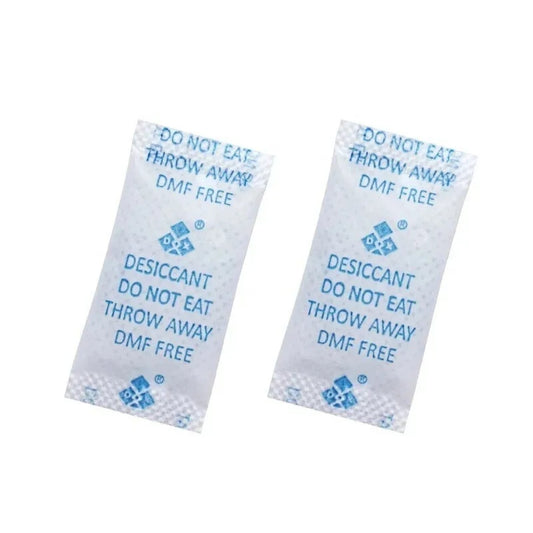 Two desiccant packets with text on a white background